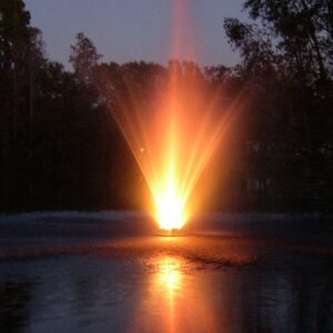 The EFL-190 Lighted Fountain casts a bright orange glow on the water at dusk, reflecting with trees in the background.